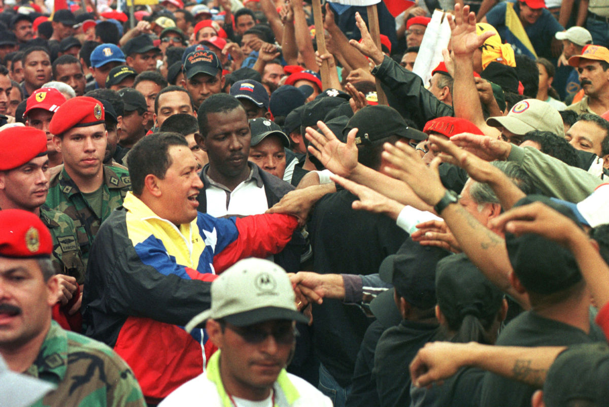 Venezuelan President Hugo Chavez greets supporters at a march, January 23, 2002, in Caracas, Venezuela.