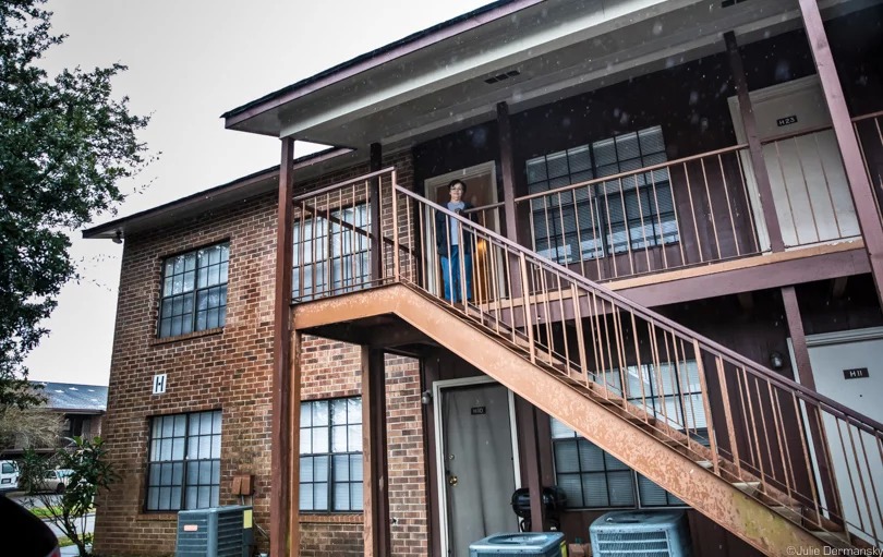 Rita Falgout, in front of the apartment in Houma that she moved to courtesy of the OCD’s Optional Relocation Assistance Program from her home on Isle de Jean Charles, while waiting for the resettlement project's community to be built.