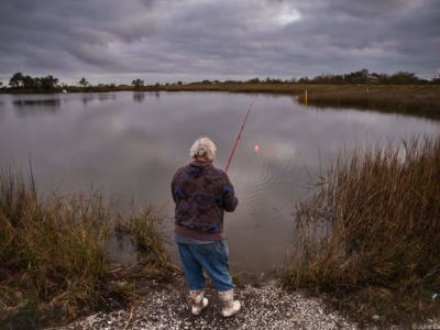 Edison Dardar fishing near his home on the Isle de Jean Charles.