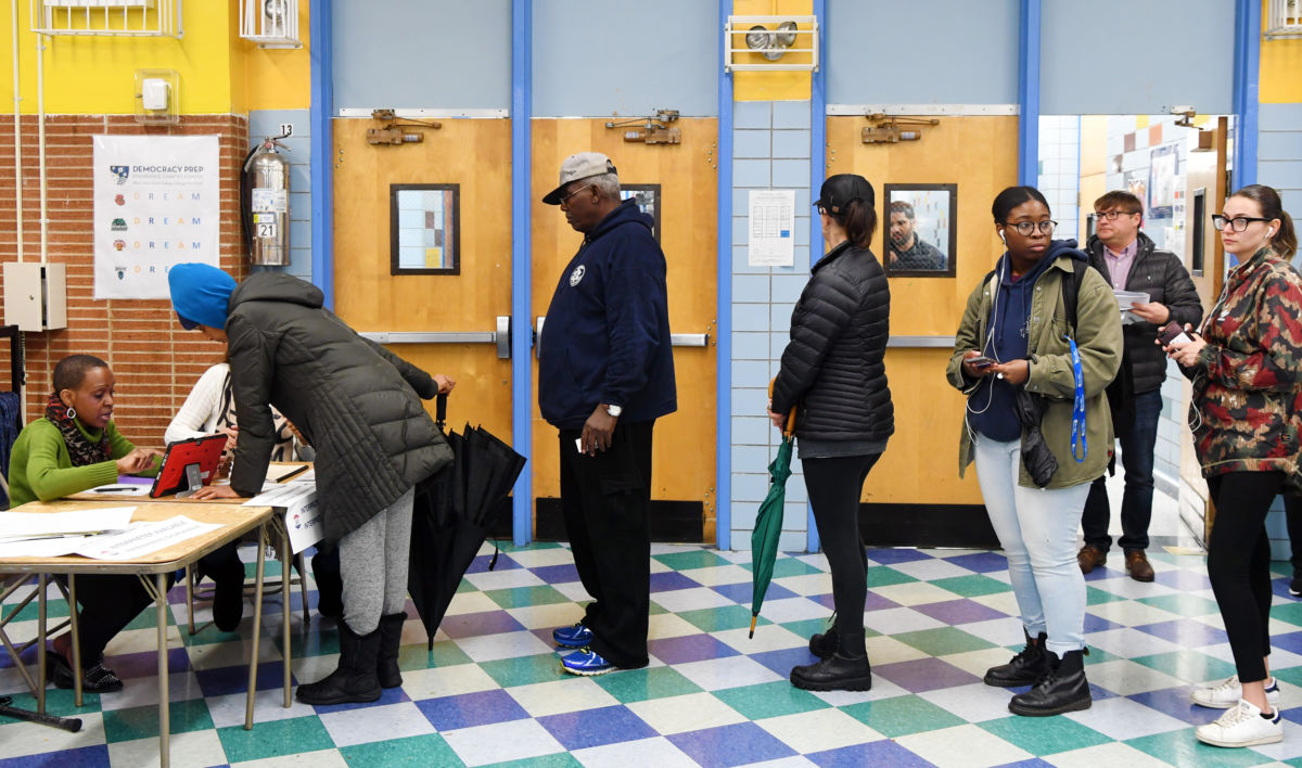 Voters register at a polling station in Manhattan of New York, the United States, on November 6, 2018.