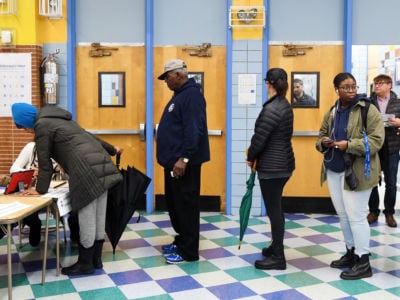Voters register at a polling station in Manhattan of New York, the United States, on November 6, 2018.
