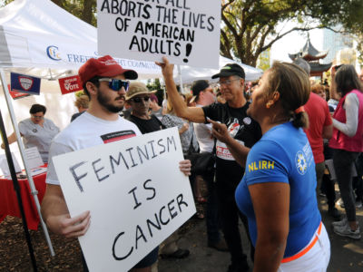 A member of the Proud Boys extremist group stages a counter-protest at the third annual Women's March on January 19, 2019, in Orlando, Florida.