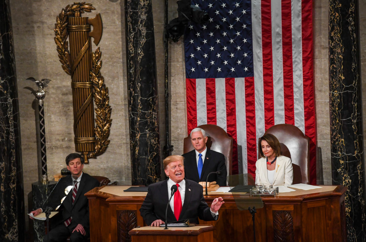 President Trump, in front of Vice President Mike Pence and House Speaker Nancy Pelosi, delivers his State of the Union address before members of Congress in the House chamber of the US Capitol, February 5, 2019, in Washington, DC.