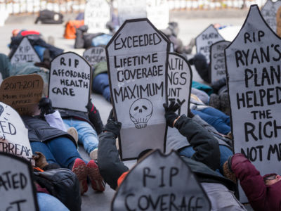 Activists gathered on March 11, 2017, near Brooklyn Borough Hall where the staged a rally and symbolic "die-in" in opposition to the repeal of the Affordable Care Act (ACA) and its replacement by Republican-authored legislation.