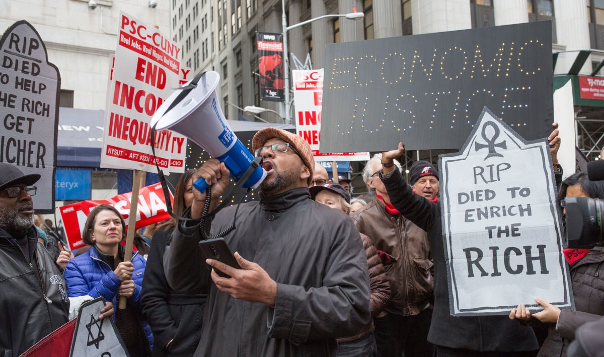 Protestors demonstrate against the 2017 tax bill on December 19, 2017, on Wall Street in New York City.