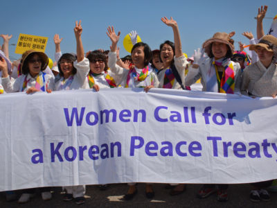 Women peacemakers march in Paju, South Korea, after crossing the demilitarized zone (DMZ) on May 24, 2015, for the International Women’s Day for Peace and Disarmament.