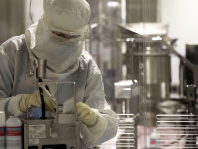 A worker at Eli Lilly in a factory producing insulin pens.