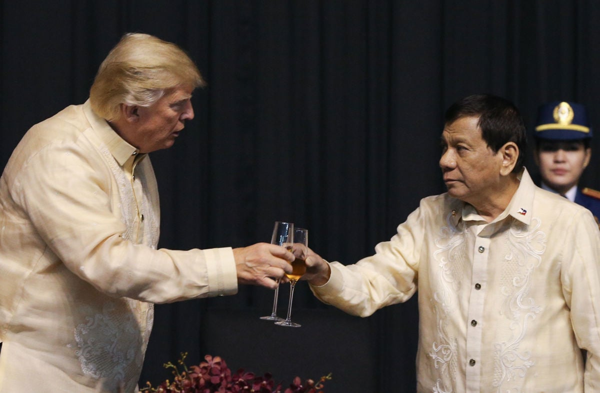 Donald Trump and Philippine President Rodrigo Duterte raise drinks