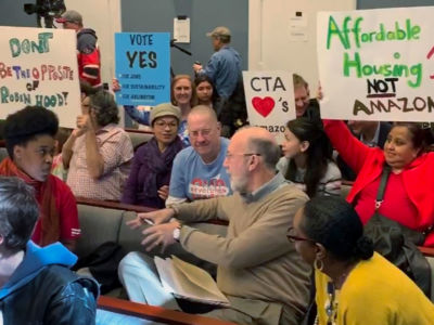 People for and against Amazon crowd into the Arlington County Board room for a meeting where more than 100 people spoke on March 16, 2019.