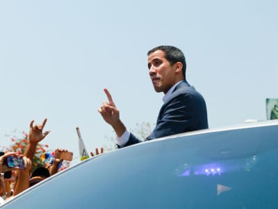 Opposition leader and self proclaimed Interim President of Venezuela Juan Guaidó waves to supporters during a Citizens' Assembly on March 16, 2019, in Valencia, Venezuela.