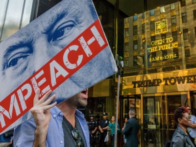 Protesters with Impeach signs rally outside Trump Tower