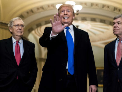 Donald Trump stands between Sens. Mitch Mcconnell and Roy Blunt