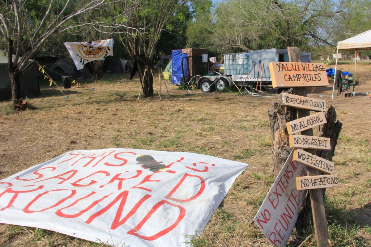 A sign displays the Yalui camp’s ground rules at the Eli Jackson Cemetery in San Juan, Texas, on March 1, 2019.