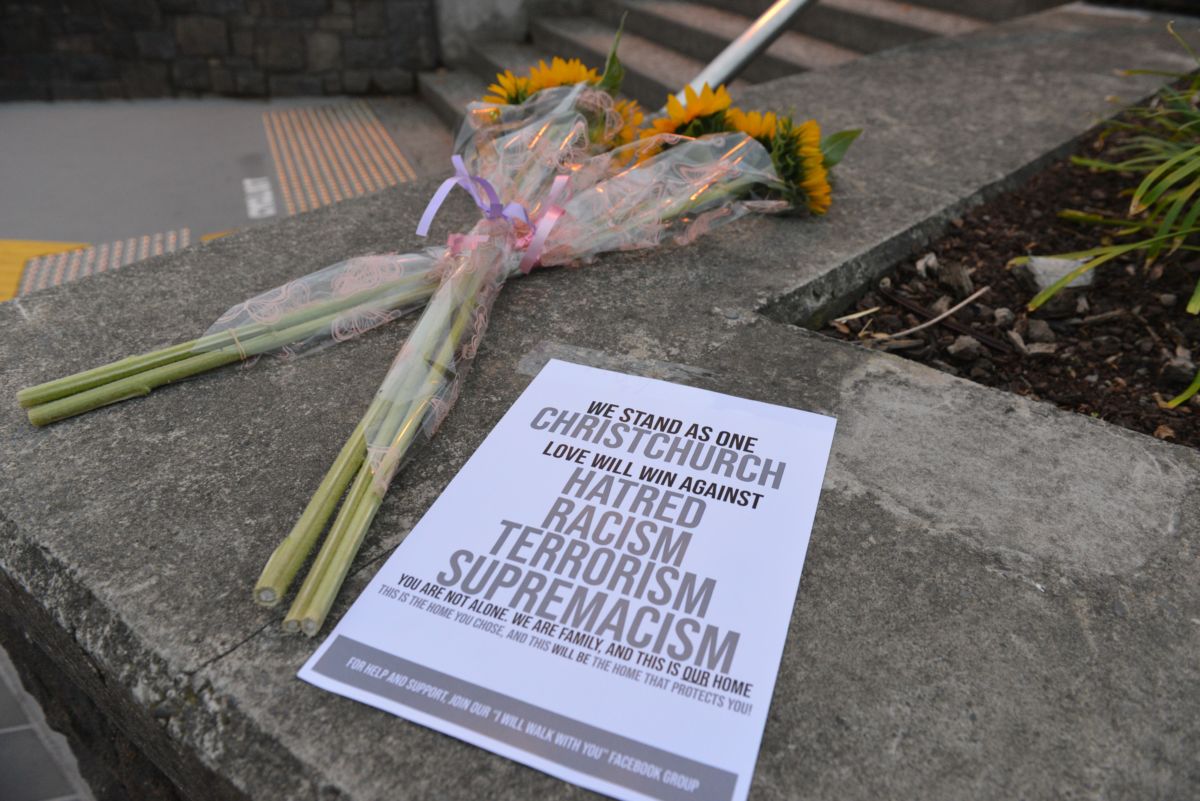 People lay flowers and notes to pay tribute at streets close to the Masjid Al Noor Mosque and Linwood Mosque, shooting area, in Christchurch, New Zealand, on March 16, 2019.