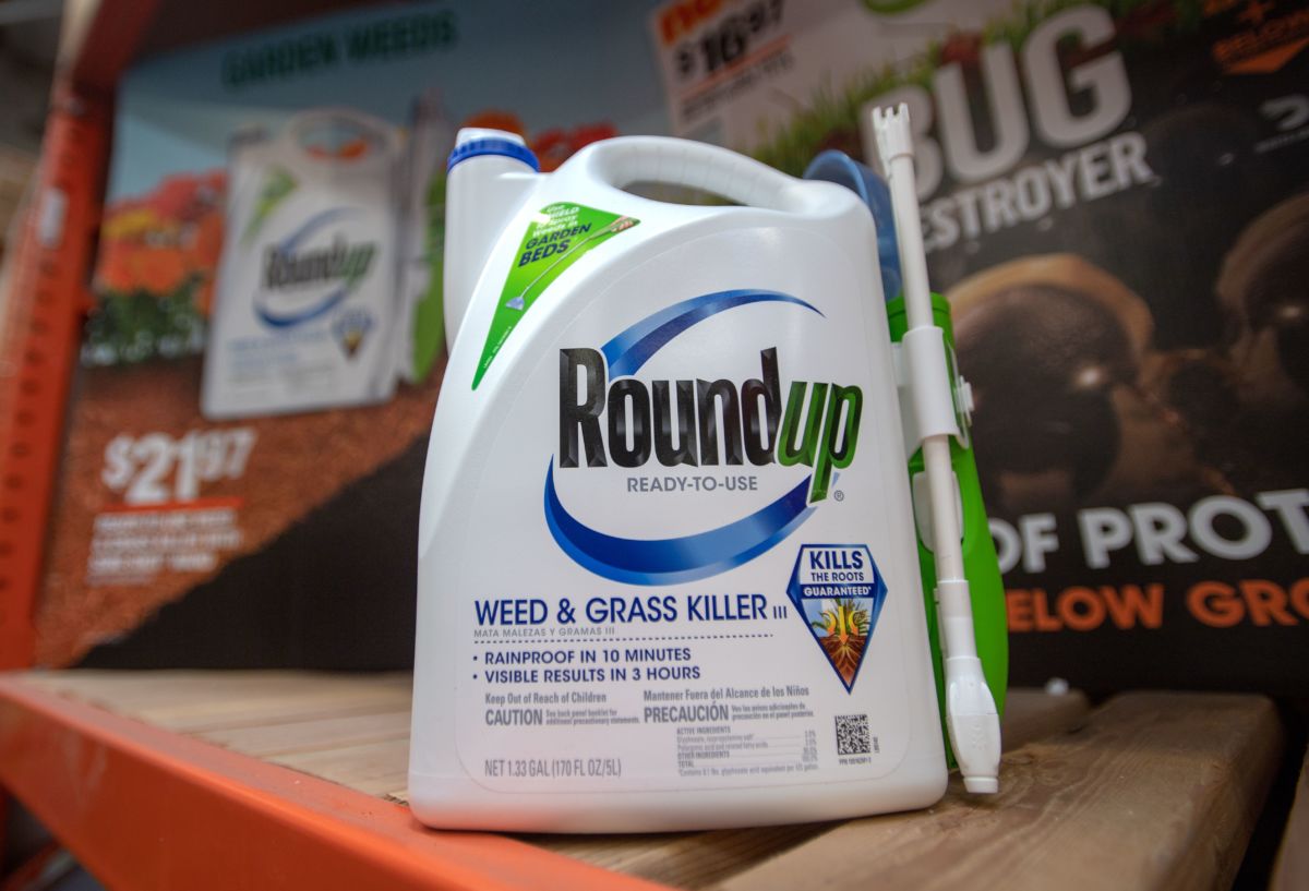 A containter of Monsanto Roundup sits on a shelf