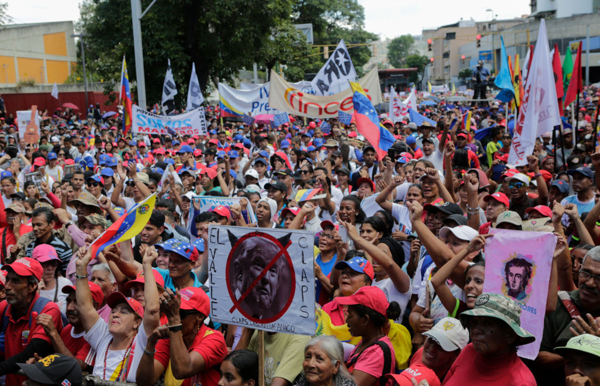 Pro-government supporters march during a rally on April 6, 2019, in Caracas, Venezuela.