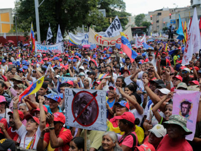 Pro-government supporters march during a rally on April 6, 2019, in Caracas, Venezuela.