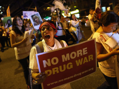 Protesters hold a candlelight vigil and a march calling for the end of the drug war on September 6, 2012, in New York City. The influence of the drug war has reshaped U.S. society.