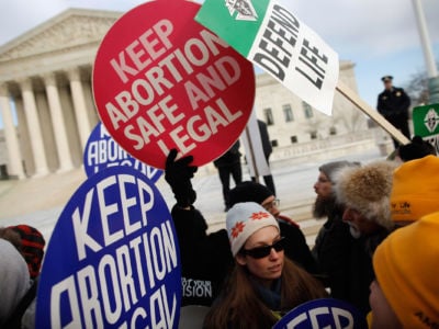 Anti-abortion and pro-choice demonstrators argue in front of the Supreme Court during the March for Life, January 24, 2011, in Washington, D.C.