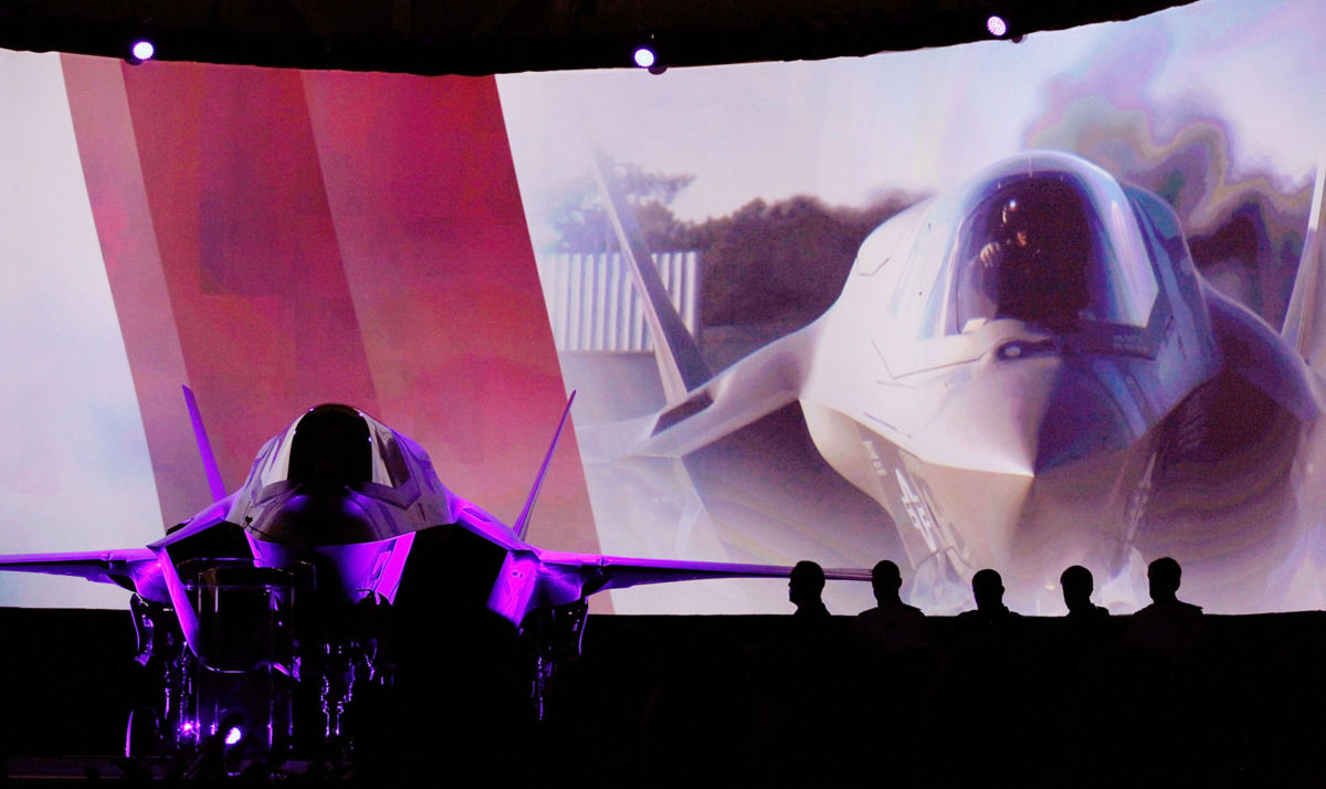 An F-35 Lightning II sits on stage during the United Kingdom F-35 delivery ceremony on July 19, 2012, at Lockheed Martin Corporation in Fort Worth, Texas.