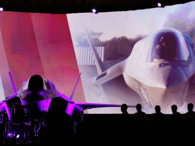 An F-35 Lightning II sits on stage during the United Kingdom F-35 delivery ceremony on July 19, 2012, at Lockheed Martin Corporation in Fort Worth, Texas.