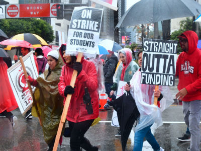 Thousands of teachers march in the rain during teachers strike in Los Angeles