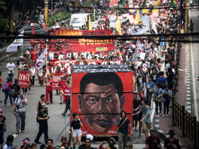 Activists march to Mendiola, near the Malacanang palace, during a protest against Philippine President Rodrigo Duterte in Manila on September 21, 2017.