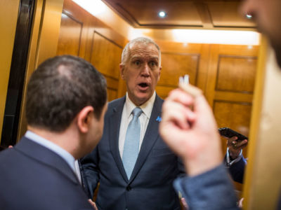 Sen. Thom Tillis speaks to reporters from elevator