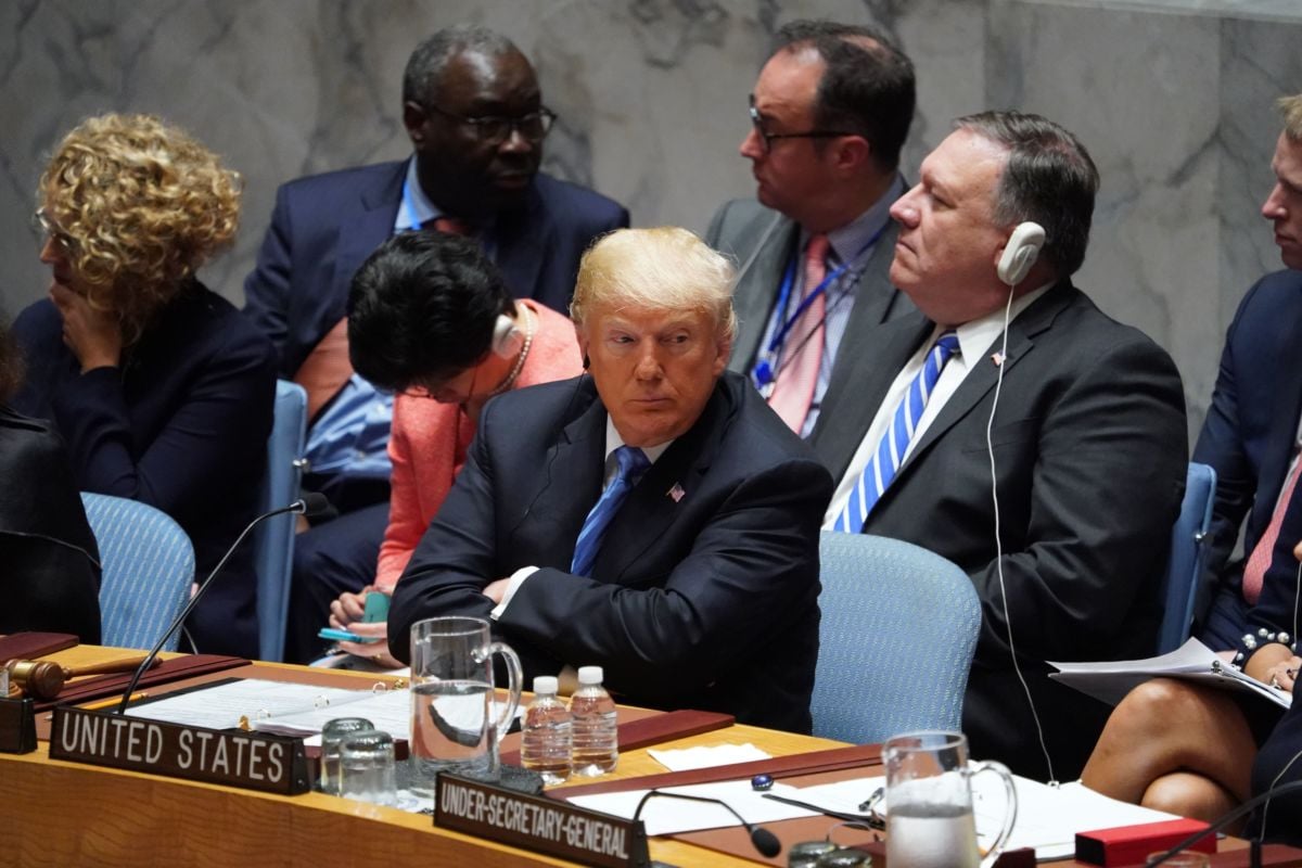 Donald trump sits with his arms crossed at the United Nations
