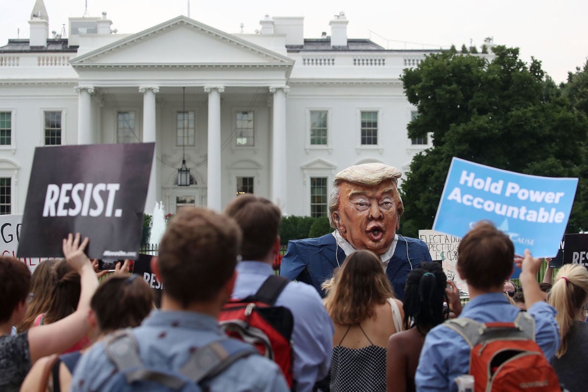 People protest against President Trump in front of the White House on July 11, 2017, in Washington, D.C.