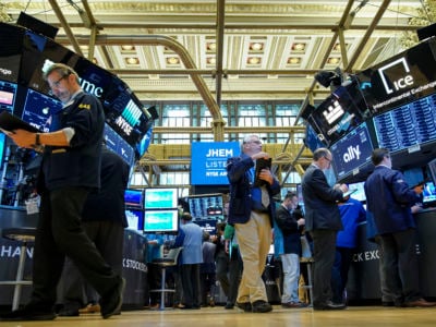 Traders and financial professionals work on the floor of the New York Stock Exchange (NYSE) at the opening bell, April 24, 2019 in New York City.
