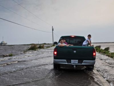 Pickup truck headed to Isle de Jean Charles on a flooded Island Road on April 13, 2019.