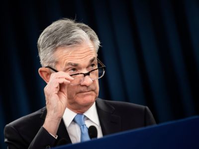 Jerome Powell looks over his glasses