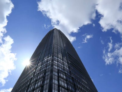 Clouds pass over the Goldman Sachs Tower on April 8, 2018, in Jersey City, New Jersey.