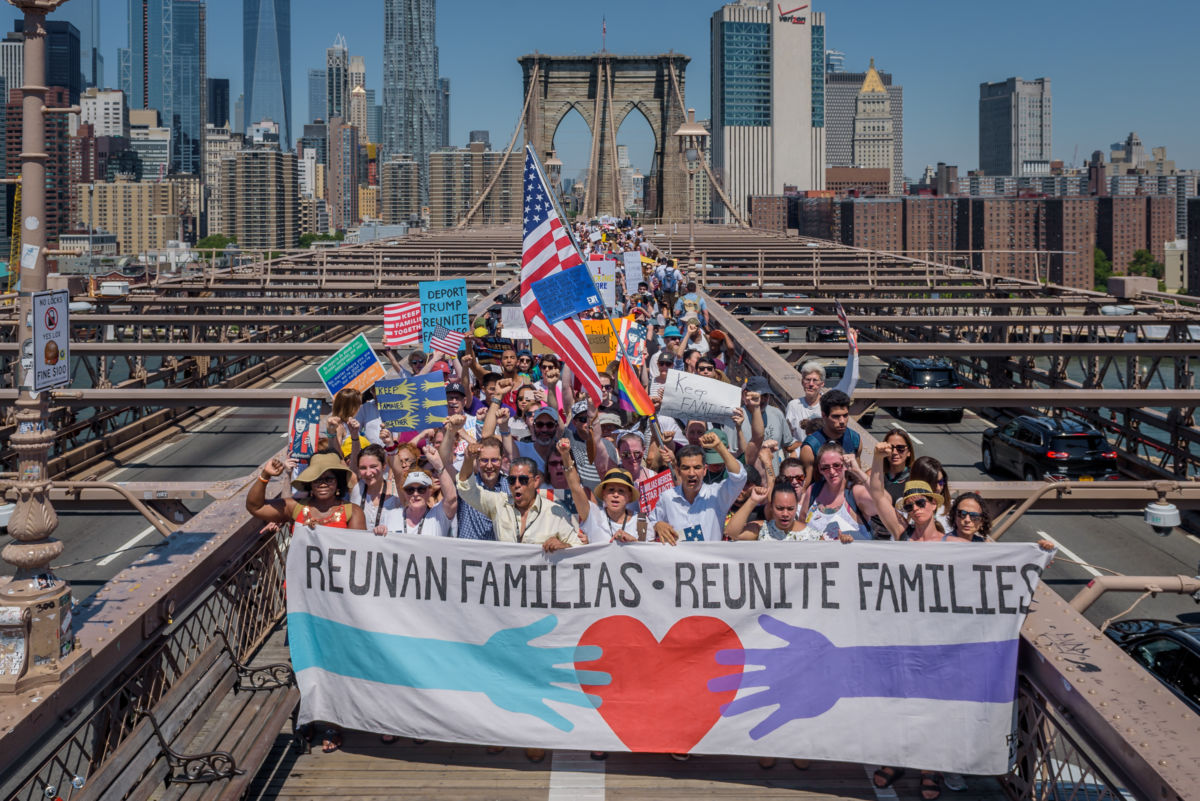 Activists march across Brooklyn Bridge support of immigrant rights