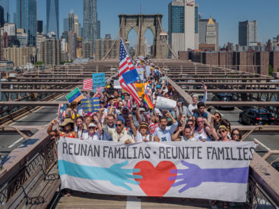 Activists march across Brooklyn Bridge support of immigrant rights