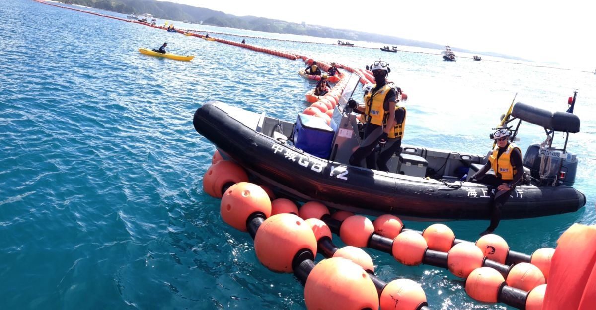 A man stands in an inflatable raft in the ocean