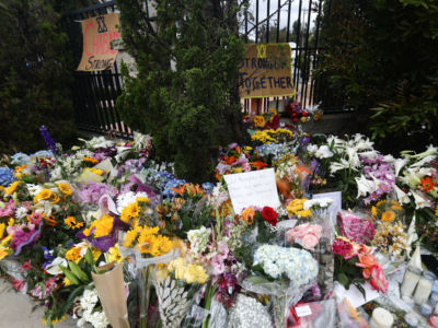 Flowers and mementos are left outside the funeral for Lori Gilbert Kaye on April 29, 2019, in Poway, California. Kaye was killed inside the Chabad of Poway synagogue by a gunman who opened fire during services.