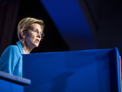 Elizabeth Warren speaks at a podium