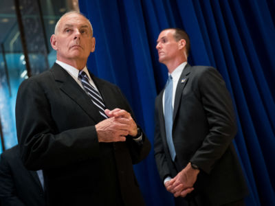 Former White House Chief of Staff Gen. John Kelly looks on as President Donald Trump speaks following a meeting on infrastructure at Trump Tower, August 15, 2017, in New York City.