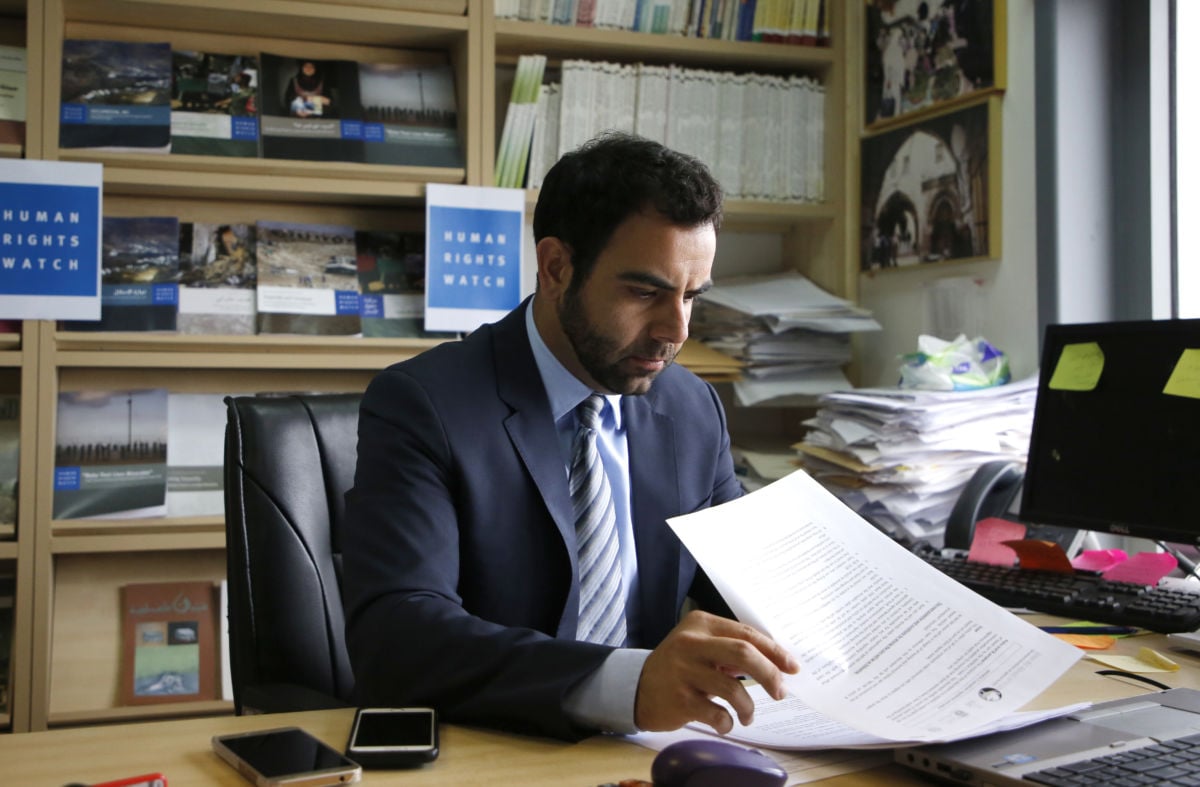 Human Rights Watch's Israel and Palestine director Omar Shakir sits at his office in the West Bank city of Ramallah on May 9, 2018.