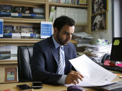 Human Rights Watch's Israel and Palestine director Omar Shakir sits at his office in the West Bank city of Ramallah on May 9, 2018.