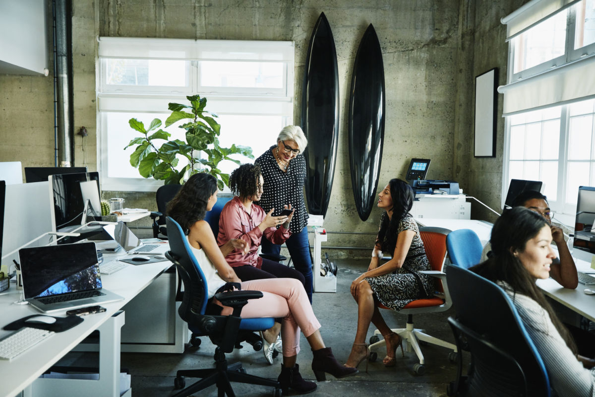 A group of women have a meeting in an office