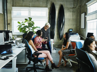 A group of women have a meeting in an office