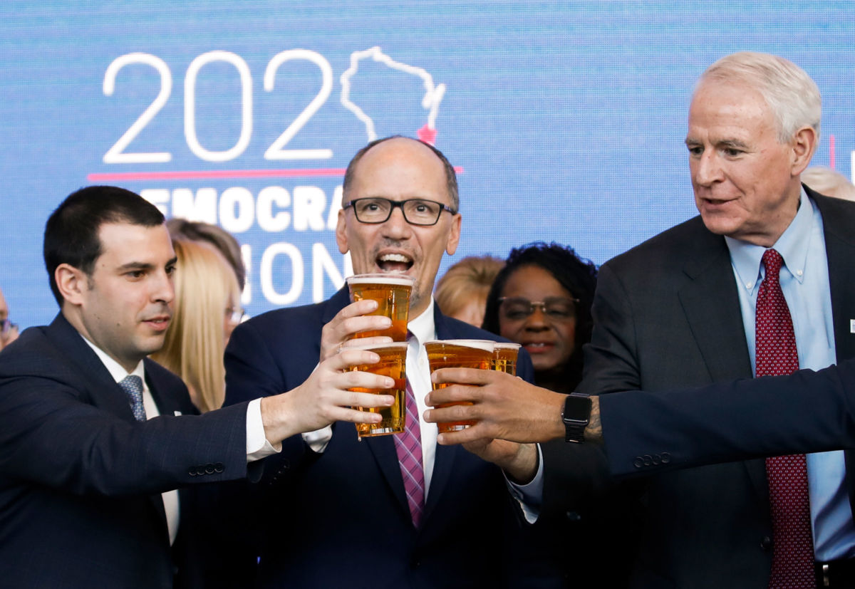Democratic National Committee Chair Tom Perez toasts with a beer during a press conference at the Fiserv Forum in Milwaukee, Wisconsin, on March 11, 2019, to announce the selection of Milwaukee as the 2020 Democratic National Convention host city.