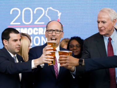 Democratic National Committee Chair Tom Perez toasts with a beer during a press conference at the Fiserv Forum in Milwaukee, Wisconsin, on March 11, 2019, to announce the selection of Milwaukee as the 2020 Democratic National Convention host city.