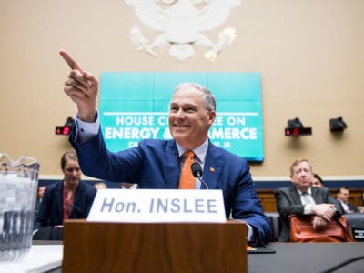 Gov. Jay Inslee takes his seat to testify during the House Energy and Commerce Subcommittee on Environment and Climate Change hearing on combatting climate change on April 2, 2019.