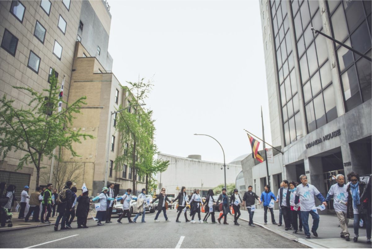 Korean Americans take part in a DMZ Peace Chain in New York City on April 27, 2019.