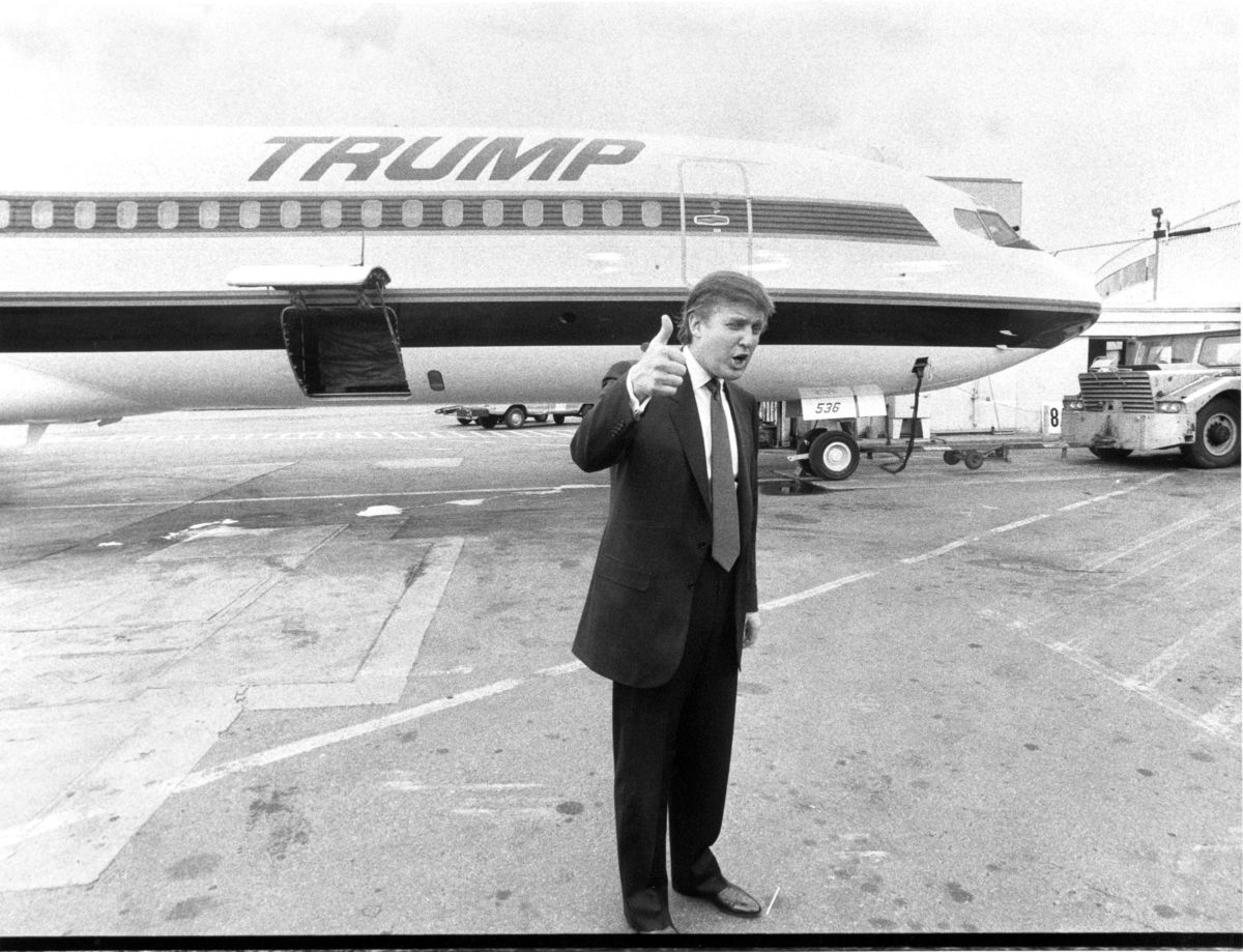 Donald Trump in front of a plane from the failed Trump Shuttle airline, September 13, 1989.﻿