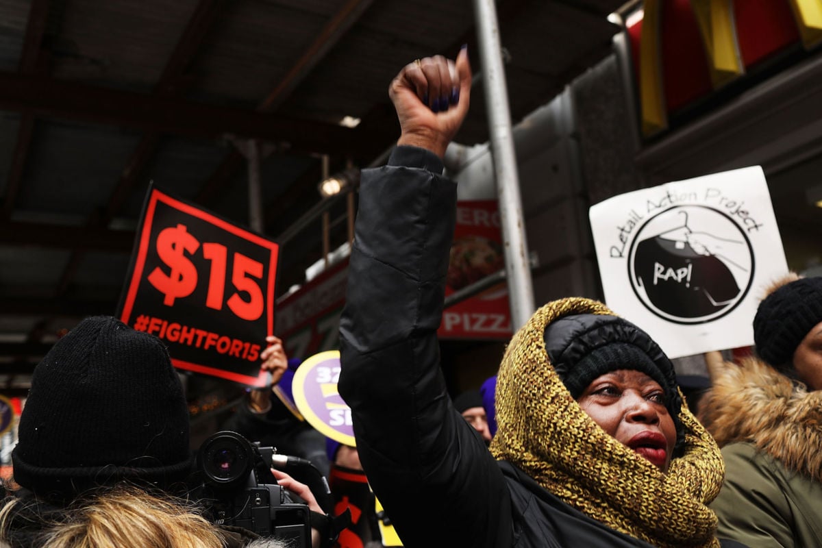 Protesters with NYC Fight for $15 gather in front of a McDonald's on February 13, 2017, in New York City.